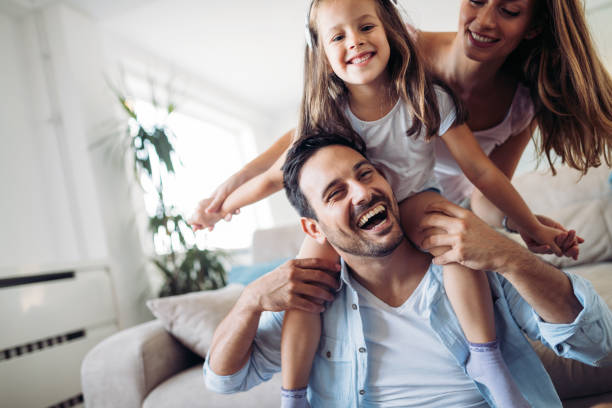 istock Happy family having fun time at home 1161328894
