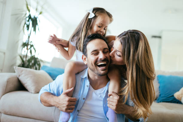 istock Happy family having fun time at home 1161328905