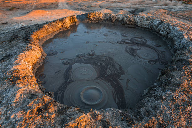 istock Mud volcano crater at sunset time 1161329396