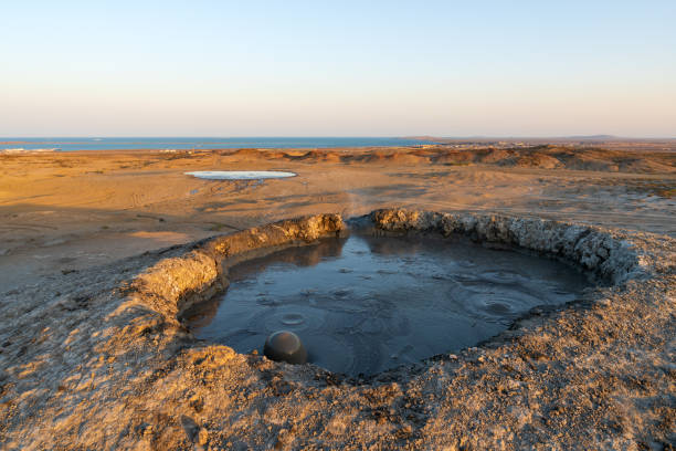 istock Mud volcano crater at sunset time 1161329411