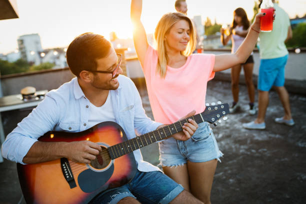 istock Happy couple having fun time at party 1161331874