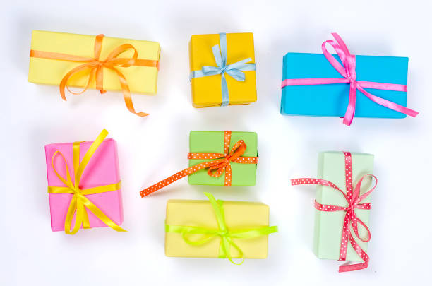istock Colorful assorted confetti with serpentine and gift boxes on white 1161337105