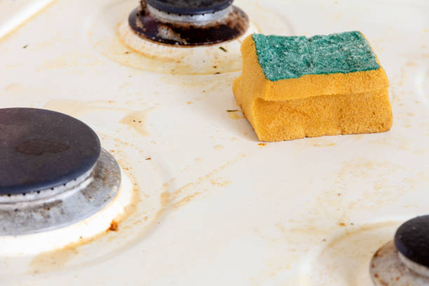 istock cleaning dirty kitchen gas stove 1161337596