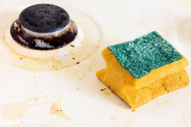 istock cleaning dirty kitchen gas stove 1161337617