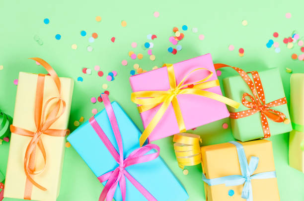istock Colorful assorted confetti with serpentine and gift boxes 1161337688
