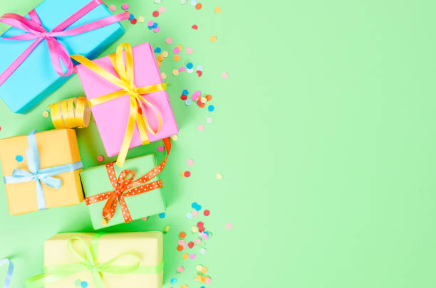 istock Colorful assorted confetti with serpentine and gift boxes 1161338392