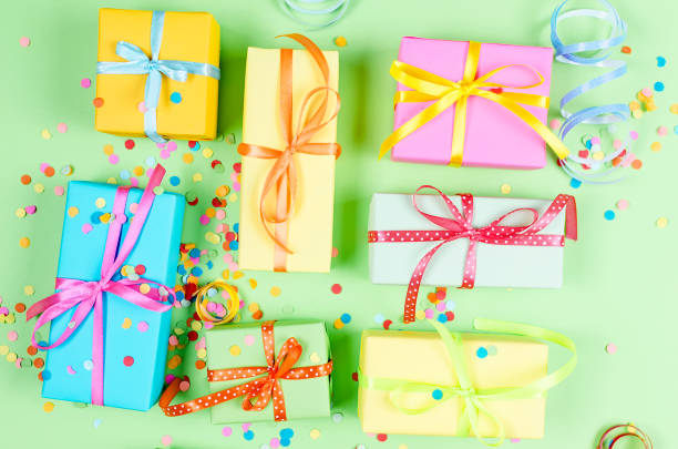 istock Colorful assorted confetti with serpentine and gift boxes 1161339549