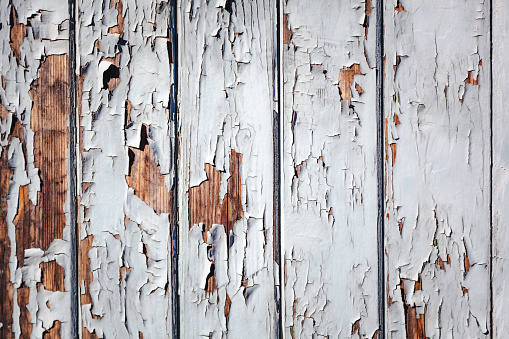 cracked white paint on wooden surface, abstract background and texture