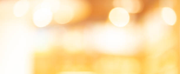 istock abstract blur beautiful orange and yellow gradient panoramic background in gala event with luxury bulbs light for design as banner template concept 1161342578