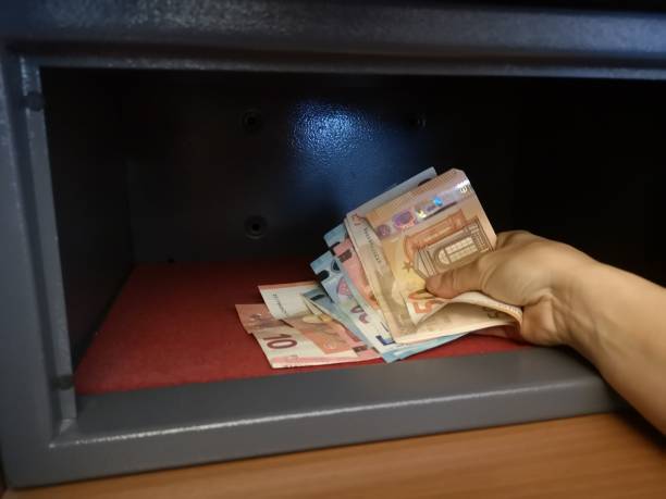istock deposit banknotes in the safe 1161342590