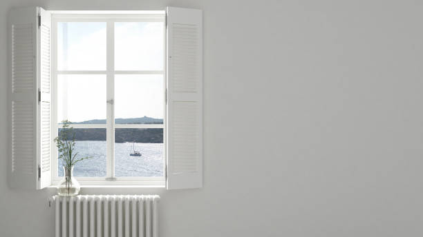 istock Stylish empty room with panoramic window close-up, classic shutters, glass vase with flowers. Sea landscape, sailboat. White background with copy space, interior design concept 1161342961