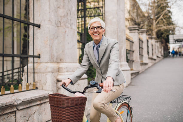 istock Woman riding bicycle 1161343750