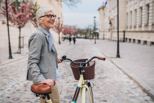 istock Woman pushing bicycle 1161344319