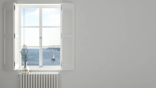 istock Stylish empty room with panoramic window close-up, classic shutters, glass vase with flowers. Sea landscape, sailboat. White background with copy space, interior design concept 1161344546