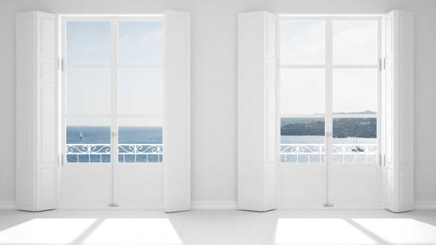 istock Stylish empty room with panoramic windows close-up, classic shutters, classic balcony. Sea landscape, granite rocks. White background with copy space, interior design concept 1161344726