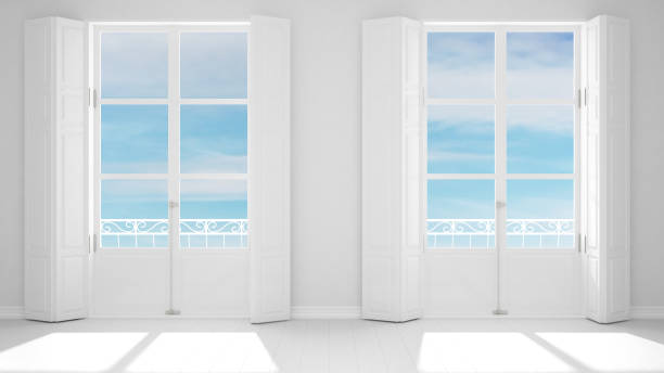istock Stylish empty room with panoramic windows close-up, classic shutters, classic balcony. Cloudy blue sky. White background with copy space, interior design concept 1161344833