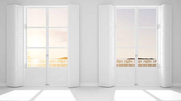 istock Stylish empty room with panoramic windows close-up, classic shutters, classic balcony. Sea landscape, granite rocks. White background with copy space, interior design concept 1161345163