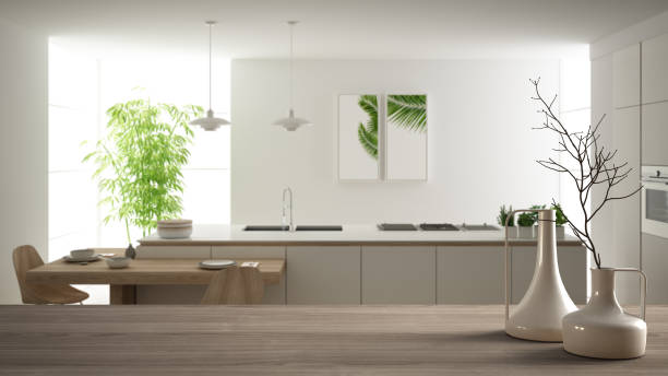 istock Wooden table top or shelf with minimalistic modern vases over blurred modern white kitchen with wooden details and parquet floor, minimalist architecture interior design 1161346772