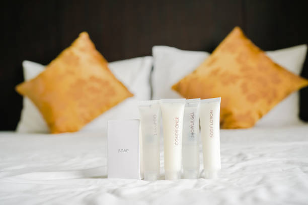 istock Toiletry set on bed with blurred pillow background in bedroom 1161347890