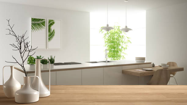 istock Wooden table top or shelf with minimalistic modern vases over blurred modern white kitchen with wooden details and parquet floor, minimalist architecture interior design 1161347963