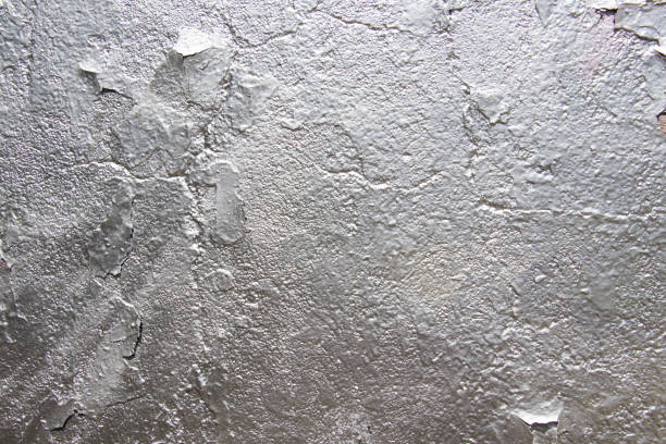istock Stucco textures background. Fragment of an old wall with silver paint. Place for text. 1161348148