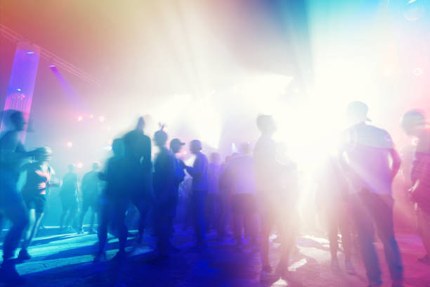 Abstract background of dancefloor with moving people
