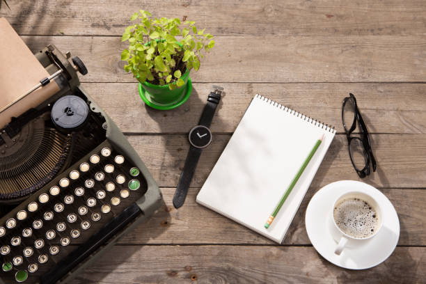 istock Vintage typewriter on the old wooden desk 1161350603