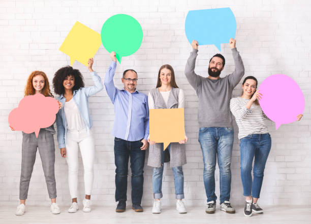 istock Group of diverse people with colorful speech bubbles 1161351800