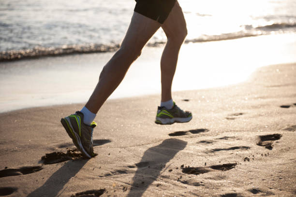 istock Man running on the beach in the morning 1161352538