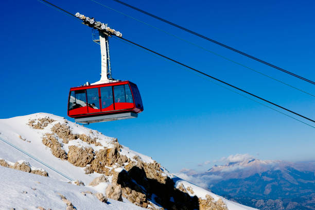 istock Cable cars carry skiers 1161353340