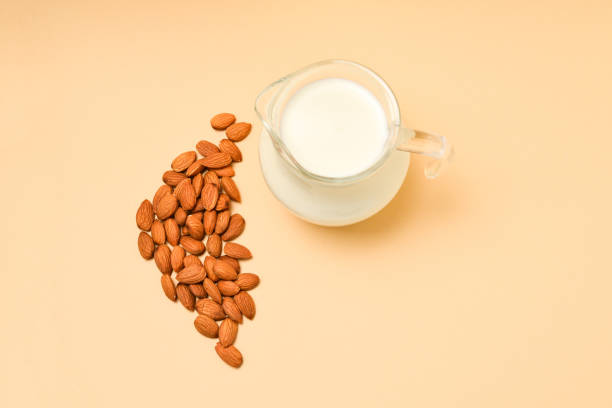 istock A jar with almond milk, nuts. Space for text or design. 1161353360