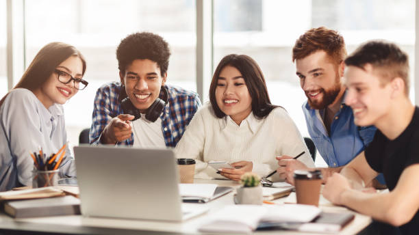 istock Group of multiracial students preparing for exams with laptop 1161353578