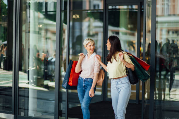 istock Girls in front of shopping mall 1161353621