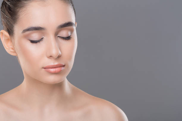 istock Millennial woman with perfect skin posing for makeup 1161353631