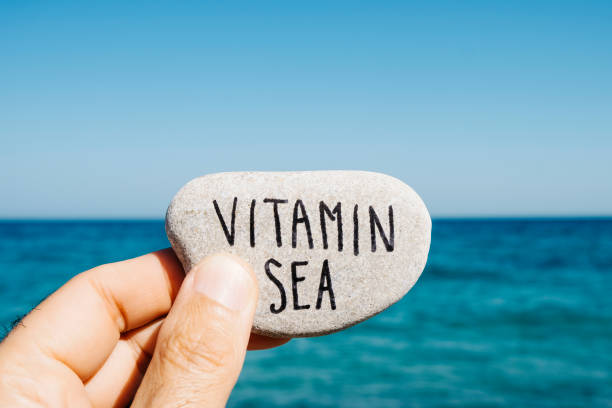 istock text vitamin sea in a stone on the beach 1161354479