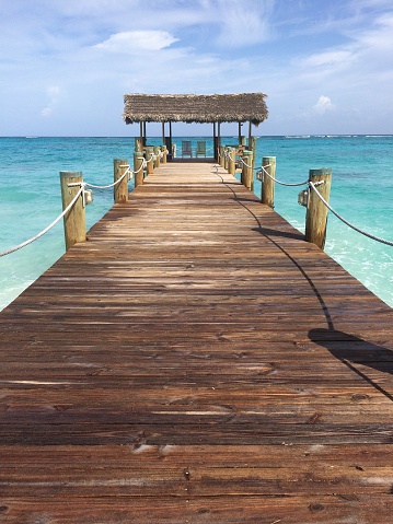 Two chairs at the end of the pier invite you to sit and enjoy the view