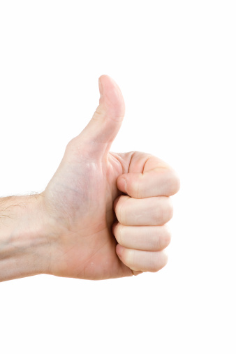 A closeup of a hand, giving the thumbs up.
