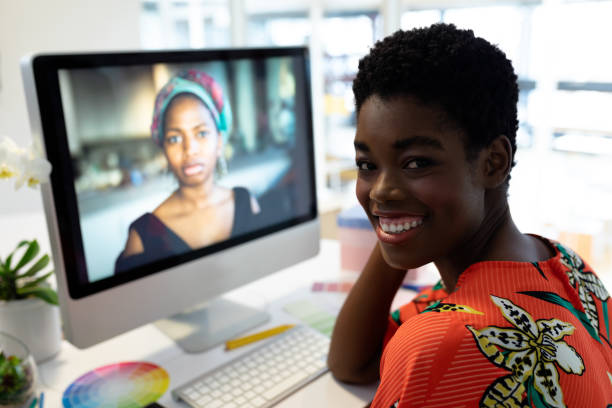 istock Female graphic designer smiling at desk in office 1161354995