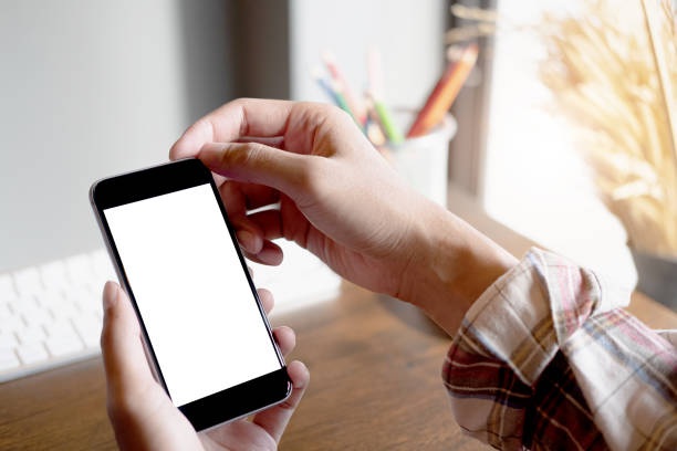 istock woman using Smartphone. Blank screen mobile phone for graphic display montage.networking service. 1161355880