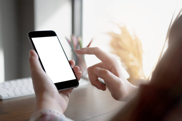 istock woman using Smartphone. Blank screen mobile phone for graphic display montage.networking service. 1161355902