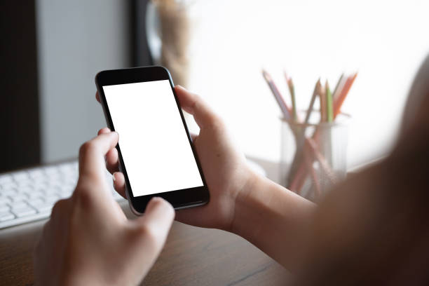 istock woman using Smartphone. Blank screen mobile phone for graphic display montage.networking service. 1161355904