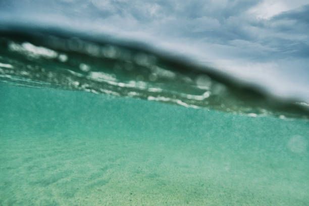 istock Above and Below the sea surface on a bad weather day with a dramatic sky. 1161357243