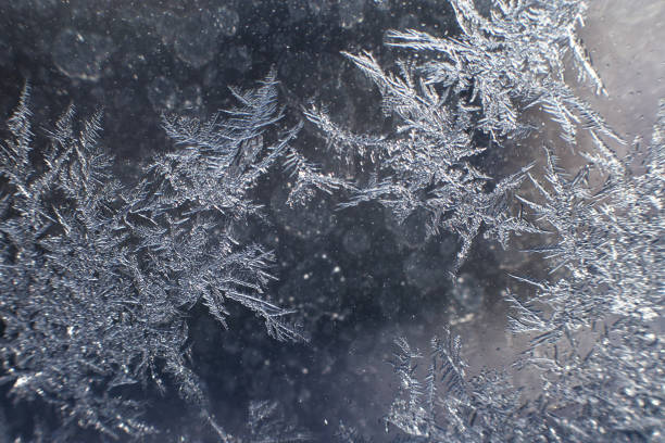 istock snow pattern on the glass from frost 1161358483