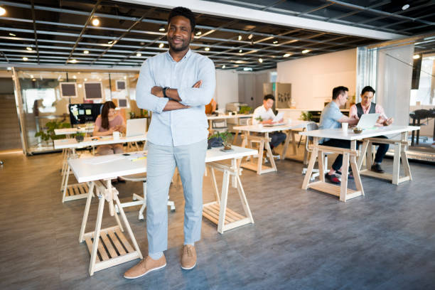 istock Businessman In Front Of His Team 1161359604