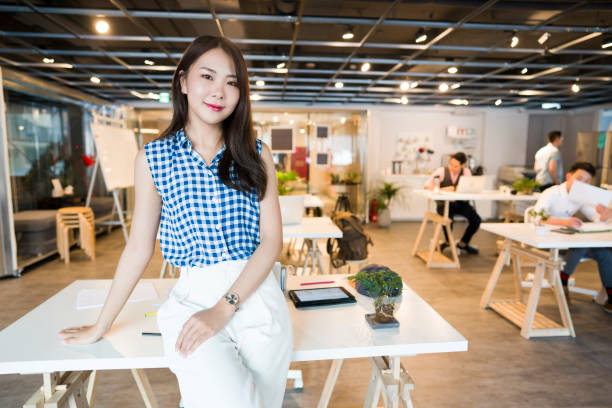istock Asian girl at her workplace 1161359718
