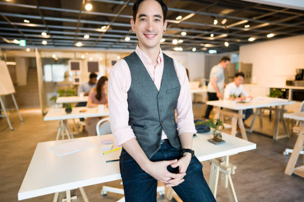 istock Office manager in front of his office coworkers 1161359768