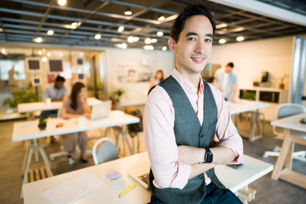 istock Office manager in front of his team 1161359792