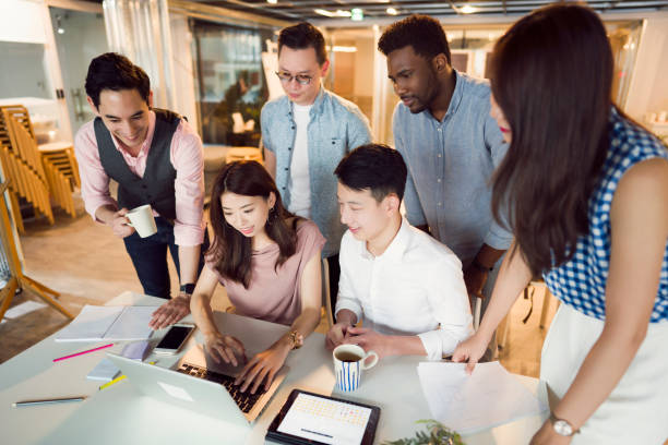 istock Business coworking with multi-ethnic employees 1161360023