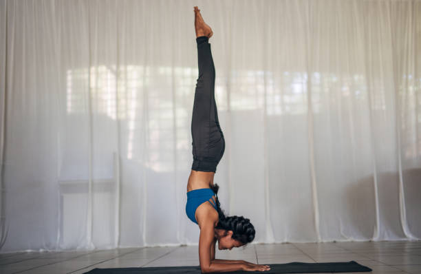 istock Fit lady doing yoga on exercise mat 1161361519