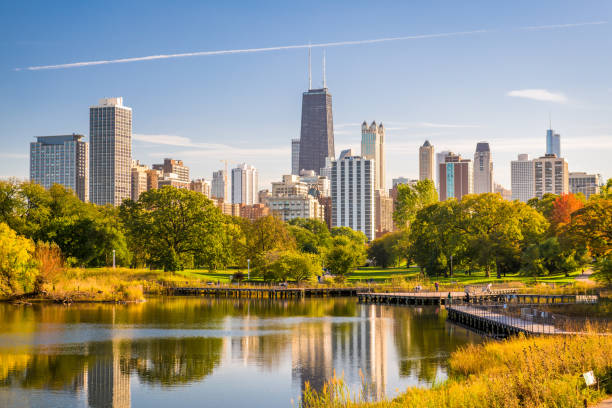 Chicago, Illinois, USA Skyline and Park Chicago, Illinois, USA skyline and park in early autumn. panorama park stock pictures, royalty-free photos & images